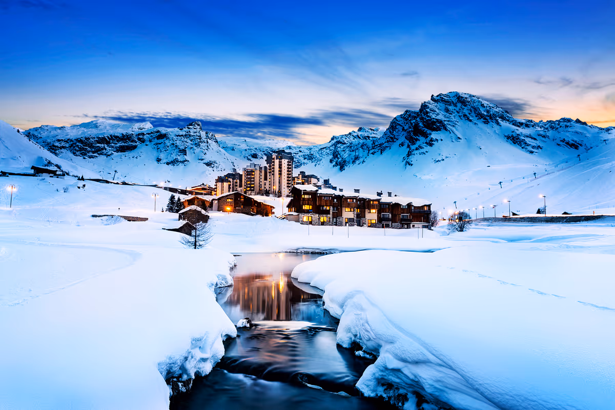 Snow-covered Alpine ski resort seen from the slopes